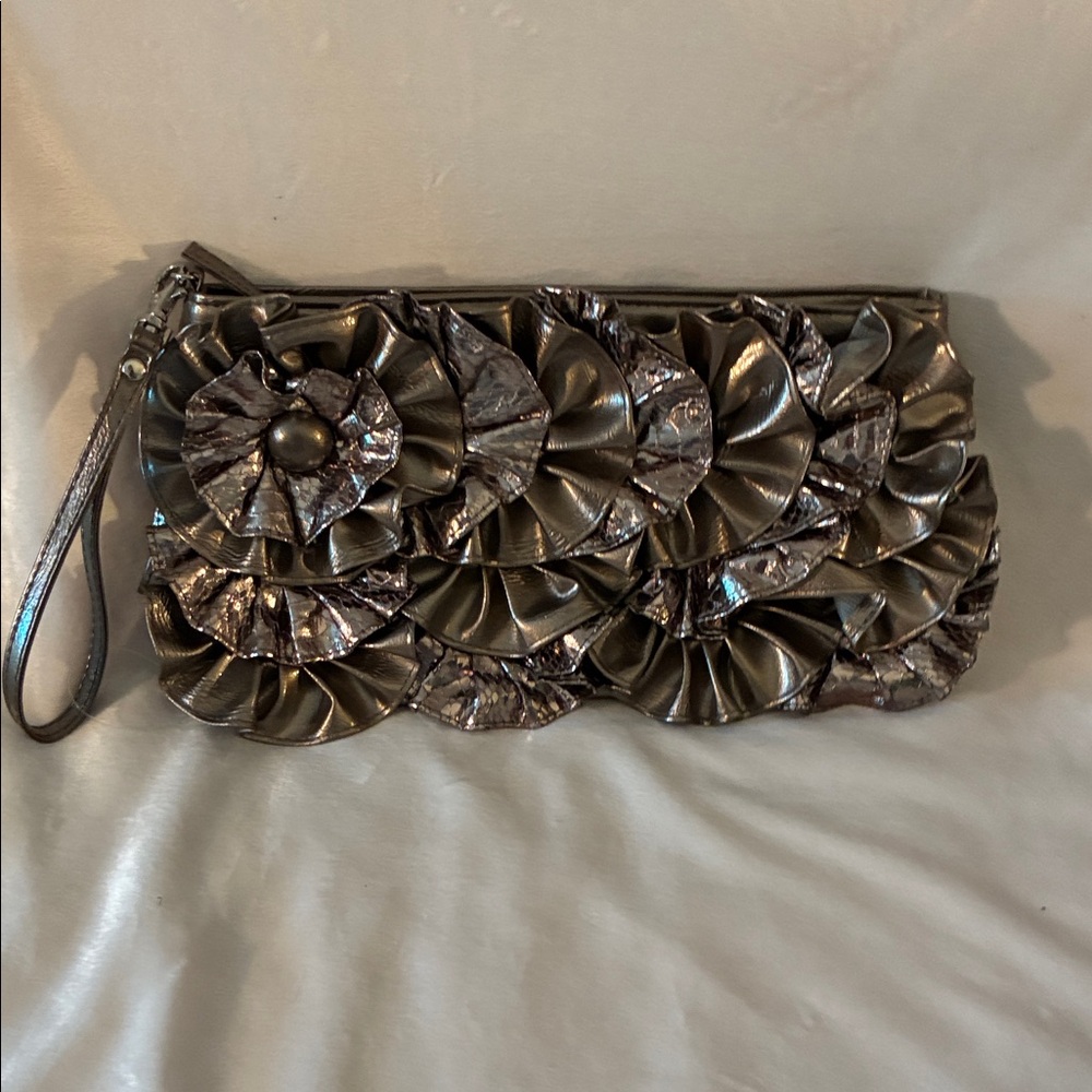 Elegant Metallic Clutch with Floral Design. NWOT BUT HAS CLEAR TAG WHERE PRICE